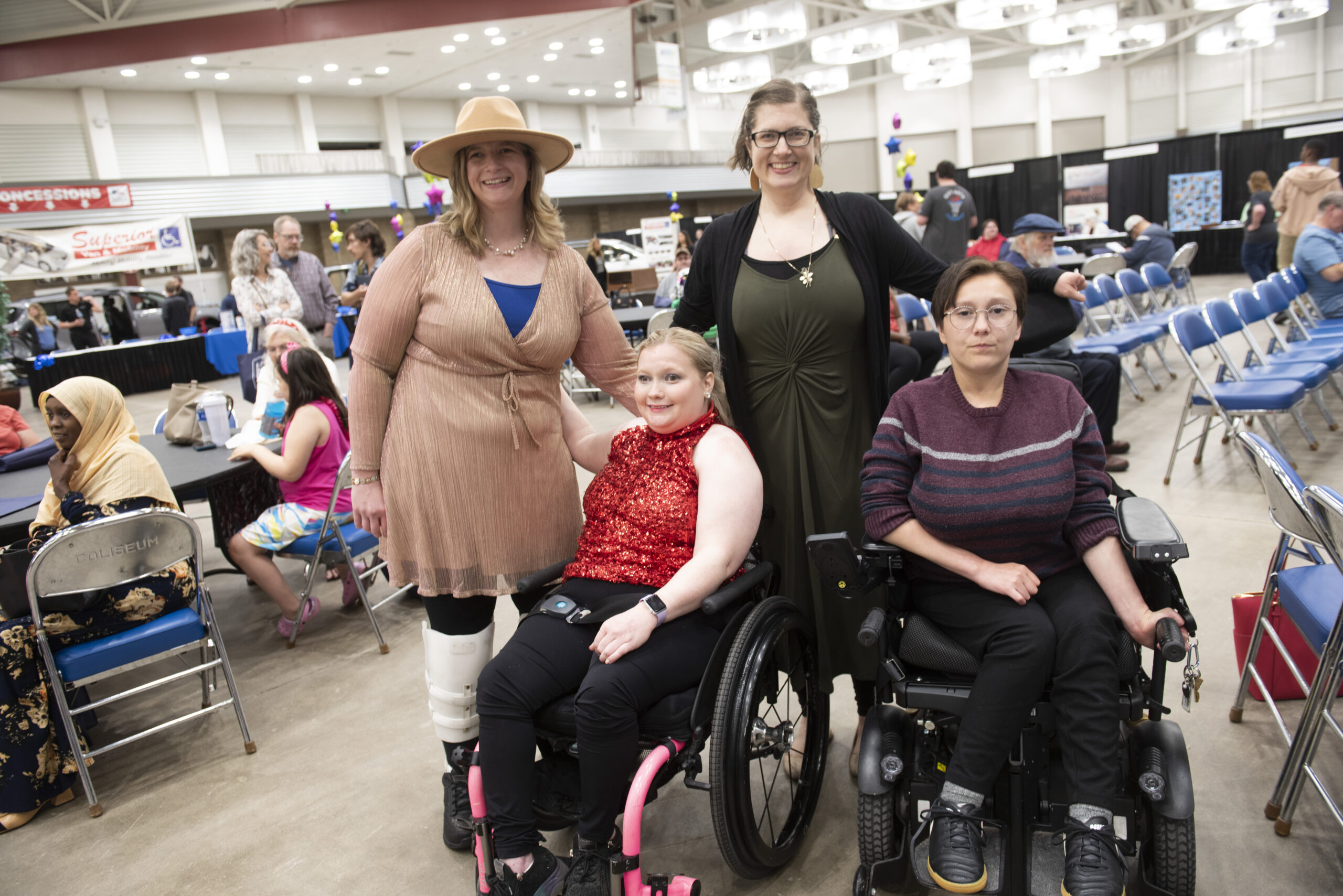 Four women pose together at the Disabilities Expo.